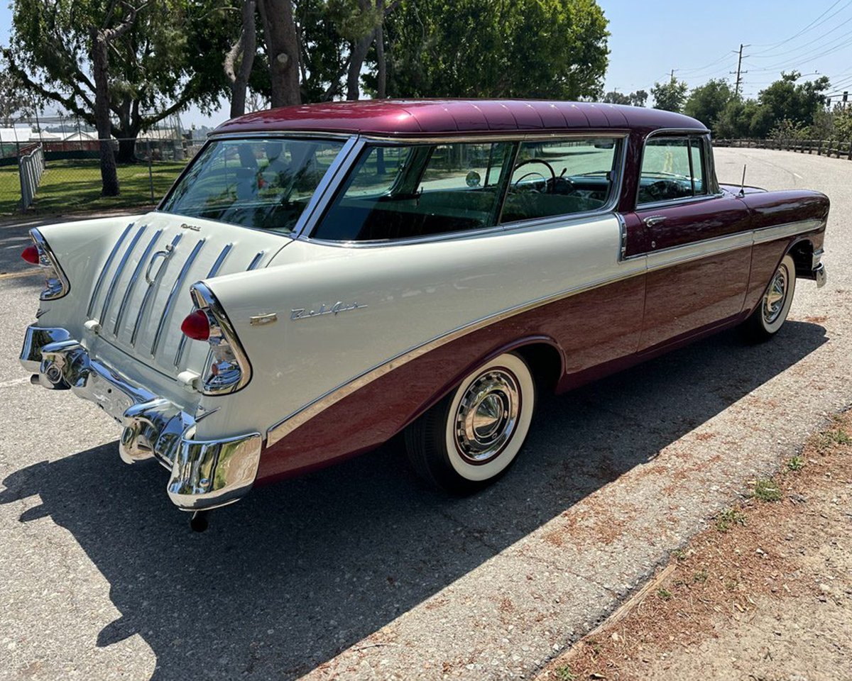 Barrett_Jackson's tweet photo. The recipient of a meticulous five-year #restoration, this 1956 @Chevrolet #NomadWagon is finished in Dusk Plum over India Ivory and powered by a period-correct authentic 265/195hp #V8 engine with a 4-barrel carburetor mated to a 2-speed Powerglide automatic transmission. https://t.co/JYfzBQ3RlD