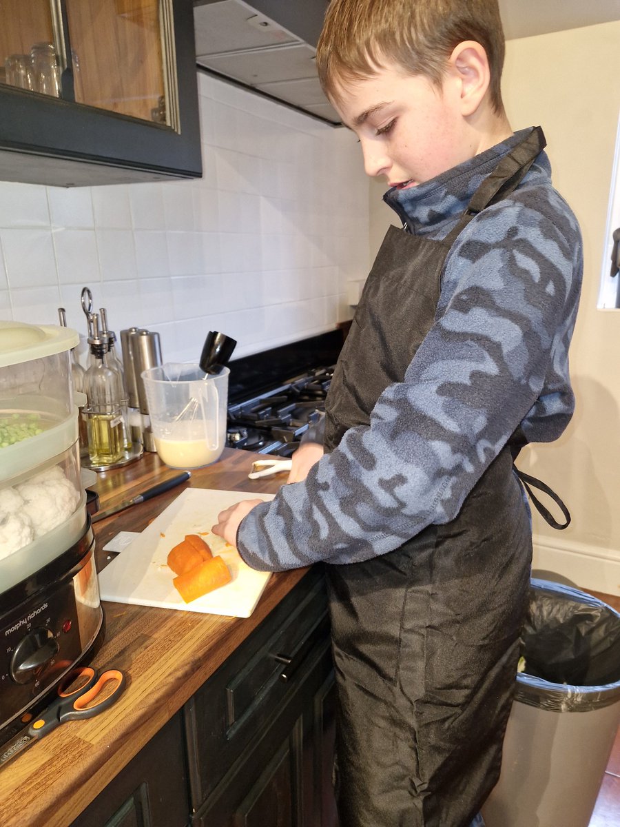 dawnmonk3's tweet photo. Matthew ticked off number 19 today with a roast pork, vegetables, home made gravy and Yorkshire puddings. It was lovely. I think Alex is on  his 4th pudding! @TrinityAcadStE https://t.co/SZPSjITdtc