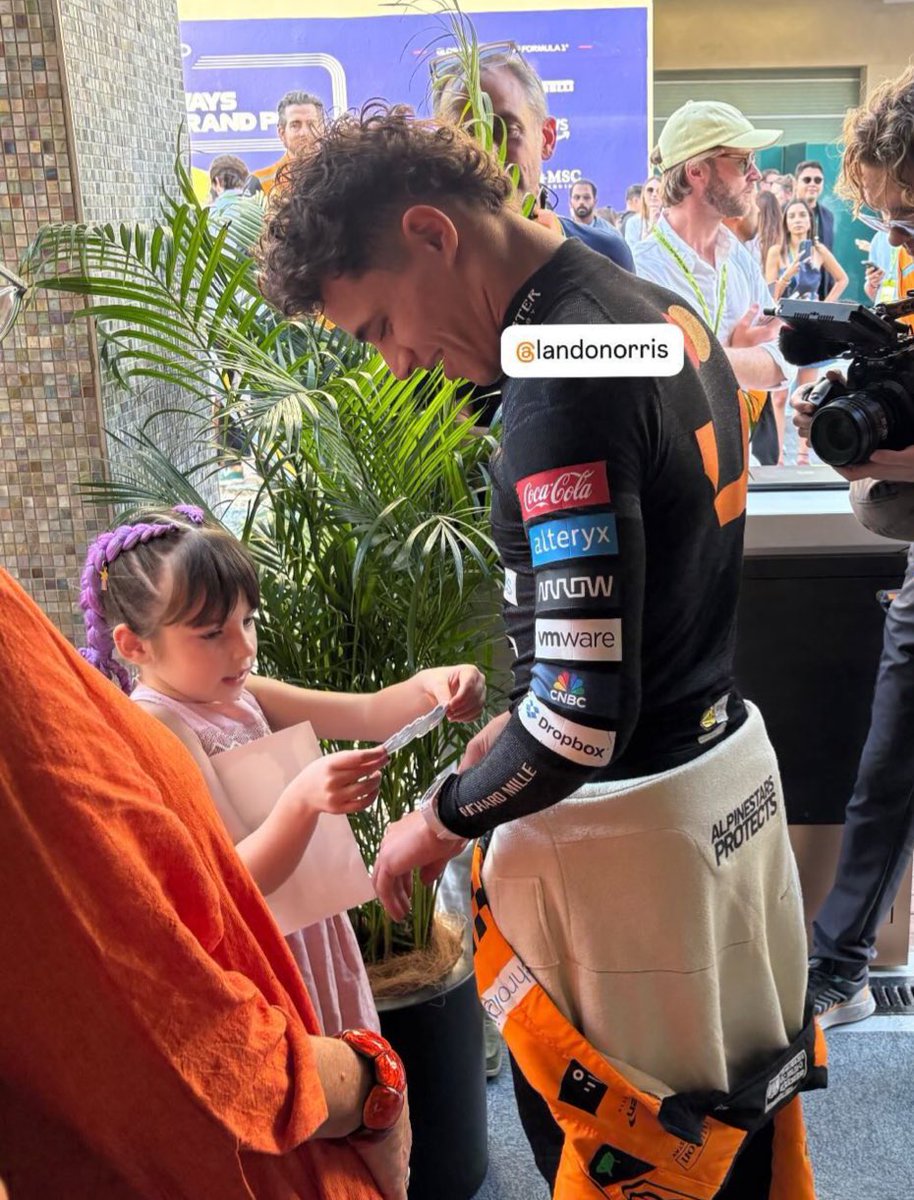 SCUDERIAFEMBOY's tweet photo. penelope was going around putting stickers on lando 😭 this divaaaa https://t.co/8oBLaQS3s0
