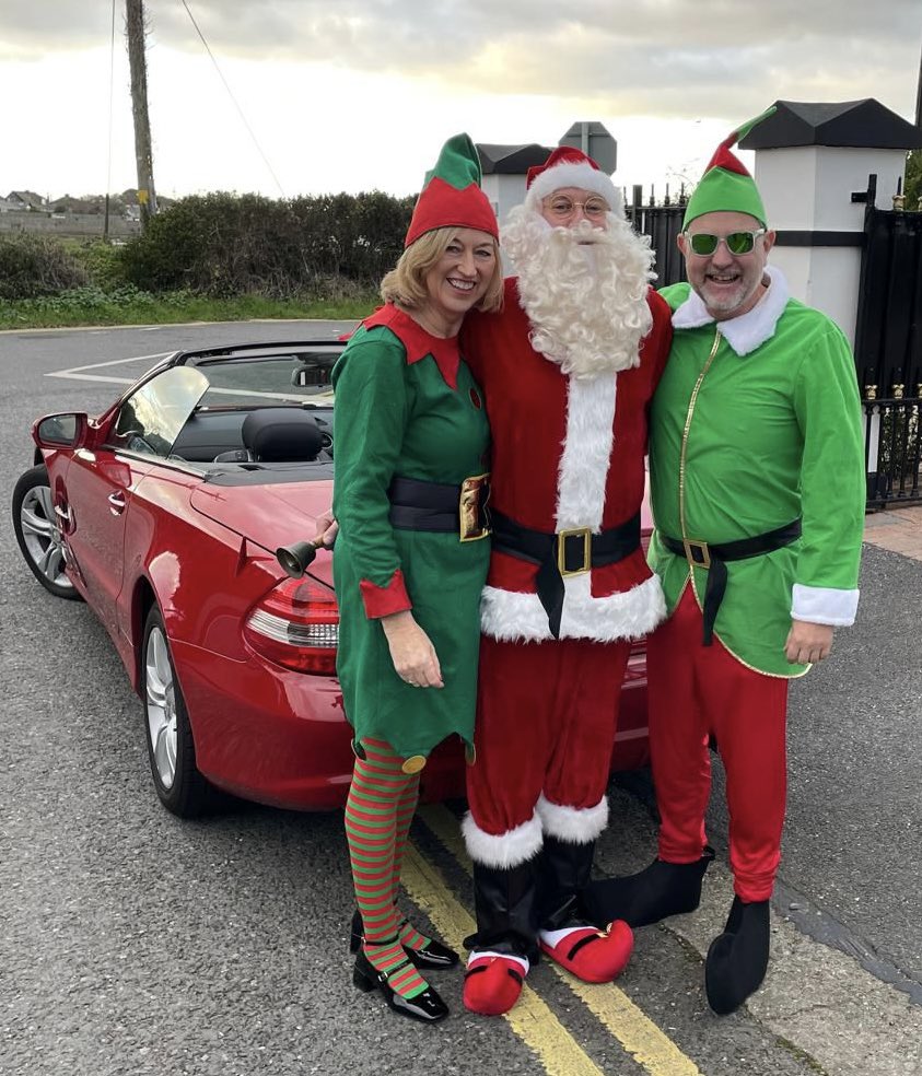 Incoming Captains Karen and Larry with Santa today.