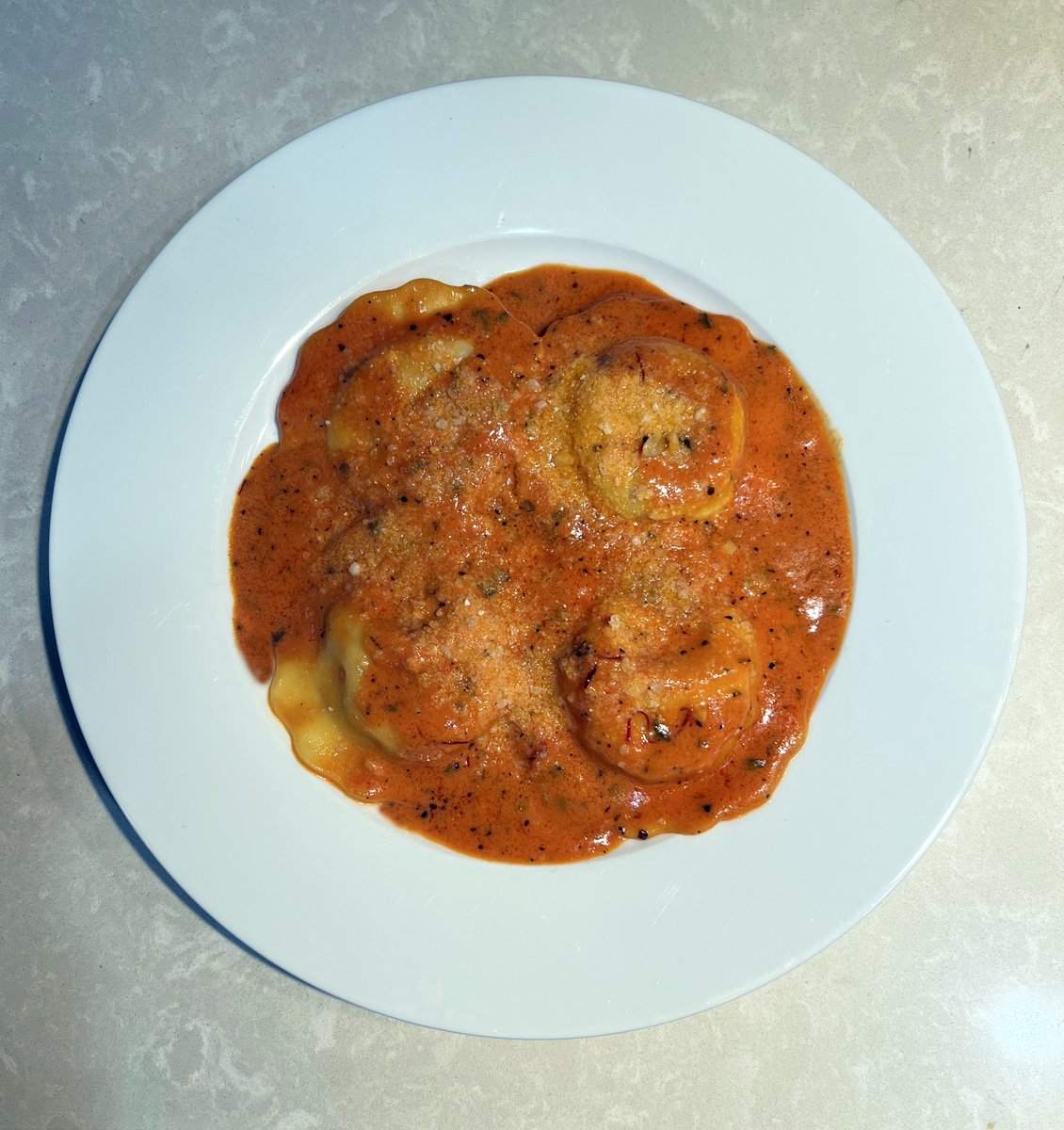Lobster Ravioli with a Saffron Vodka Sauce. Don't be afraid to try cooking. I don't know what I'm doing most of the time but when it works out, it feels good and tastes GREAT!