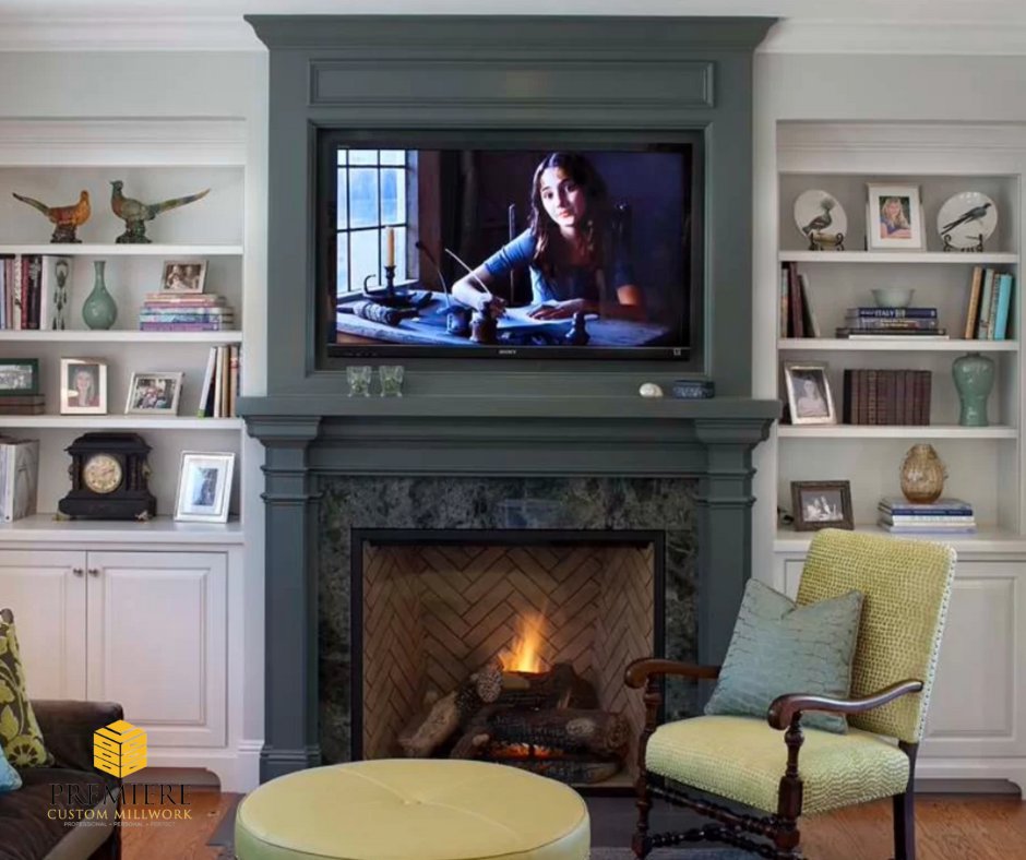 A custom cabinetry setup around your fireplace can create a beautiful focal point for the holidays! From stylish storage to cozy display shelves, there’s a place for everything. #PremiereCustomMillwork #CustomClosets #CustomFireplace #CustomCabinetry #CustomKitchens #WallUnits