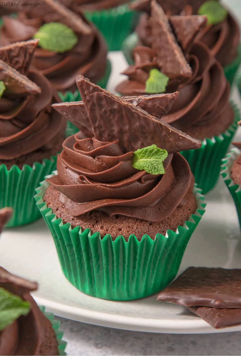 These After Eight Cupcakes are a moist chocolate sponge with a smooth and luxurious chocolate buttercream. In the centre is a mint fondant filling - just like an After Eight chocolate! On top is an After Eight of course, and a mint leaf. Get the recipe: buff.ly/41qr4id