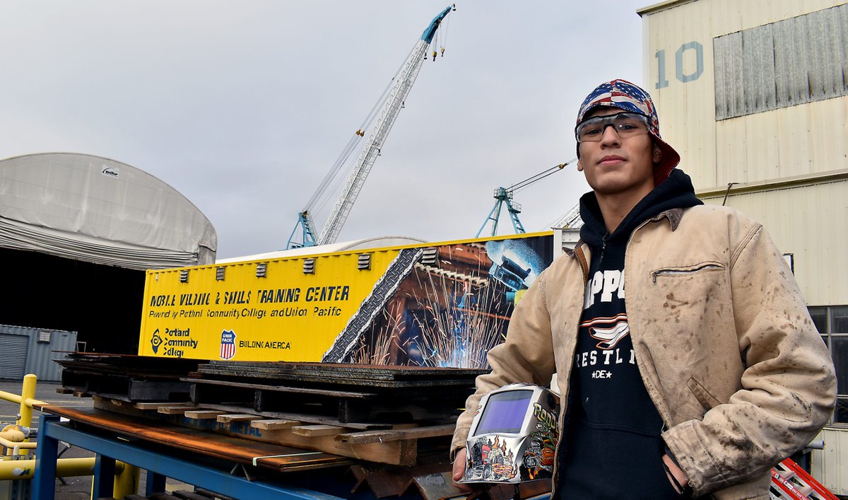 PortlandCC's tweet photo. 🚐🔥 Welding on Wheels! 
Meet Ruben Gonzalez from Scappoose, who discovered his passion for the skill thanks to PCC’s Mobile Welding Outreach Center -- made possible by @UnionPacific! This innovative program brings hands-on training directly to communities, inspiring future welders to pursue careers in high-demand fields.

Ruben is now earning credits in PCC’s Maritime Welding Program, aiming for a bright future in shipbuilding and fabrication. With over 500 students trained so far, this mobile classroom is transforming lives and expanding access to the skilled trades!🧑‍🏭👩‍🏭
Learn more: https://t.co/hArm2E8KOU

 @ORCommColleges @PDXBIZJournal @PDX_BizAlliance @RepBonamici