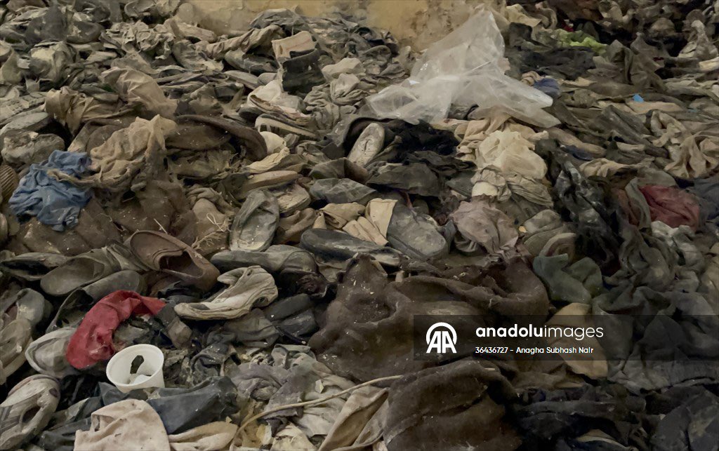 Osinttechnical's tweet photo. Reporters from Anadolu, following Syrian White Helmet rescue teams, found rooms filled with hundreds of discarded shoes and other items of clothing in Assad’s Sednaya prison. https://t.co/QhRlDyN6kN
