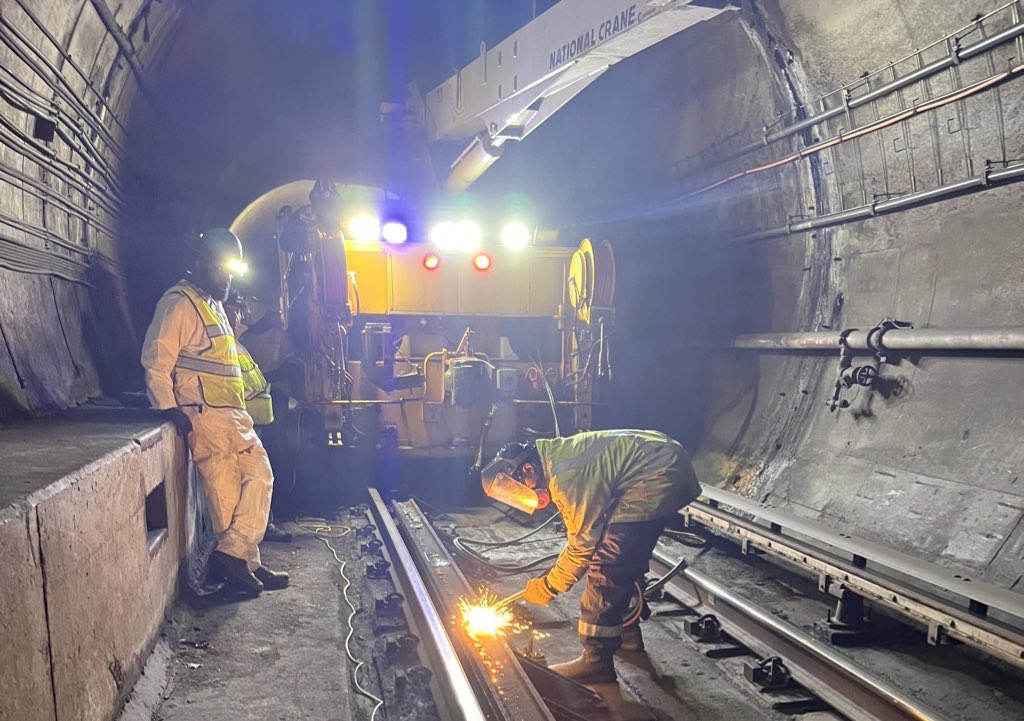 wmata's tweet photo. Over the weekend, #YourMetro team was busy on the Blue &amp; Orange lines:

▶️ Poured concrete for grout pad maintenance.  
▶️ Removed bolts from restraining rails using grinders &amp; torches.

These efforts aim to improve track stability &amp; safety. Thanks for your patience! #wmata https://t.co/DkHuQI4dap