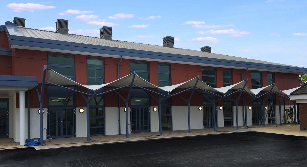 A walkway canopy can be a flexible and cost effective way to provide all weather protection with a strong aesthetic look, and is also ideal for joining two buildings or creating a link between two buildings #schoolcanopy buff.ly/3dJjLvR