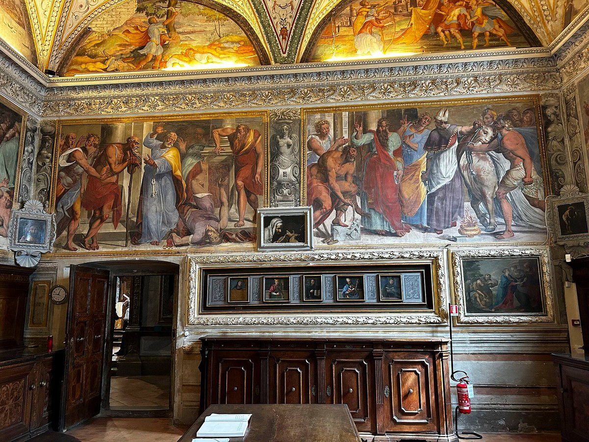 Basilica di San Pietro (Perugia), Santa Francesca Romana istruita da un Angelo di un ignoto caravaggesco, attribuita a Giovanni Antonio Galli, detto lo Spadarino. In calce: cinque quadretti del Perugino con immagini di Santi.