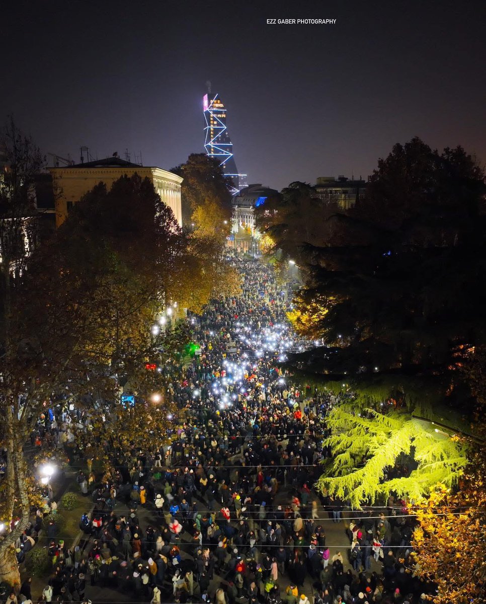KShoshiashvili's tweet photo. For the 12th day and night, hundreds of thousands of Georgians across the country have continued protesting, fighting for their statehood and European future, which have been seized by the Georgian Dream regime. Despite the Russia-style terror imposed by GD, protesters remain undeterred, demanding the immediate release of all unlawfully detained individuals, new elections, and a future in the West, not Russia.

Photo by @Ezz_Gaber_Photo
