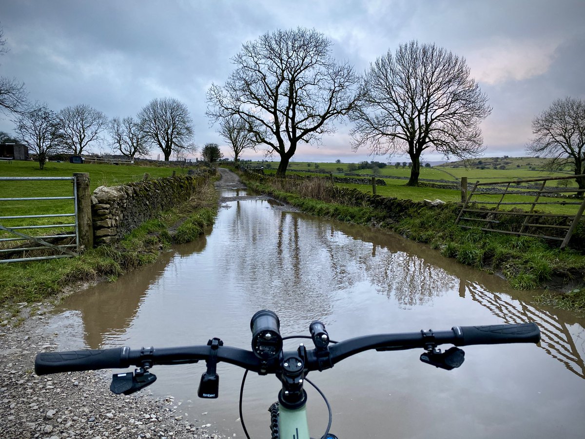 Feet wetting season again around Priestcliffe <a href="/KoftheP/">keeper of the peak</a>. Can’t avoid the puddles &amp; some pretty deep, but they’re either rideable or raised verge to walk on. Photo taken before darkness (&amp; rain) fell this evening. Turned pretty grim, but obviously good to be out 😎 #mtblife