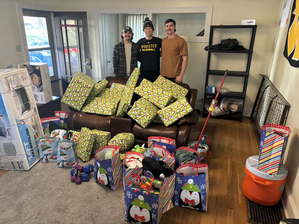 Team raised money, bought, and then wrapped gifts for the Wayne County Services adopt-a-family program.