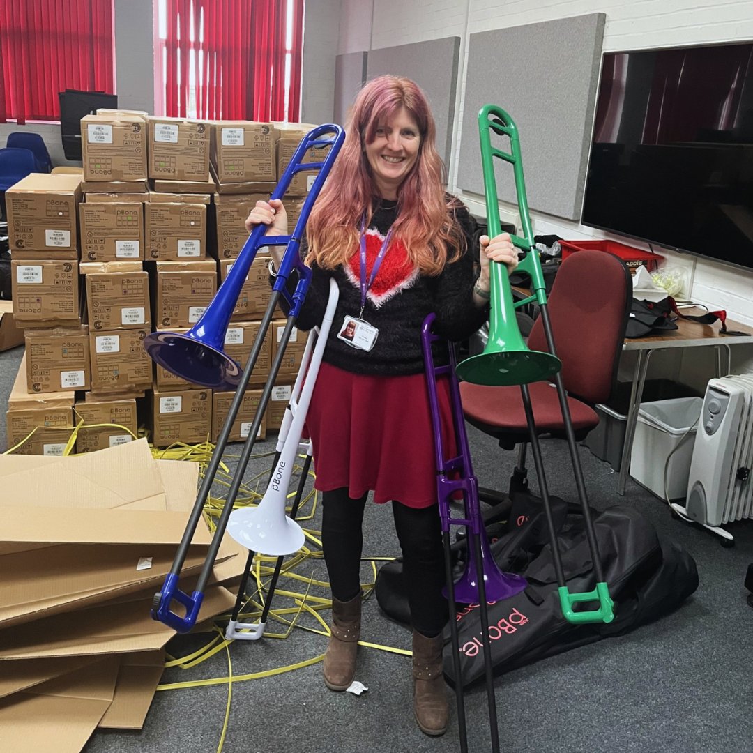 berksmusictrust's tweet photo. 🚨  Exciting delivery alert! 🚨 

Our Resources Team are busy unpacking over 160 shiny new pBones and Kirsten is here to model their beautiful colours! These lightweight Bb trombones are perfect for beginners. We can’t wait to see them in action!

#pBone #pTrombone https://t.co/J84tFpF07C