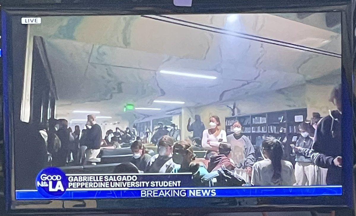MarlaTellez's tweet photo. .@pepperdine student Gabrielle Salgado shows us how close the #Franklinfire is to campus…. the glow of the fire visible from the evacuation center on campus. 

Students are masked because of the heavy smoke, sheltering in place inside the University’s “fire resistant” buildings, including Payson Library.
