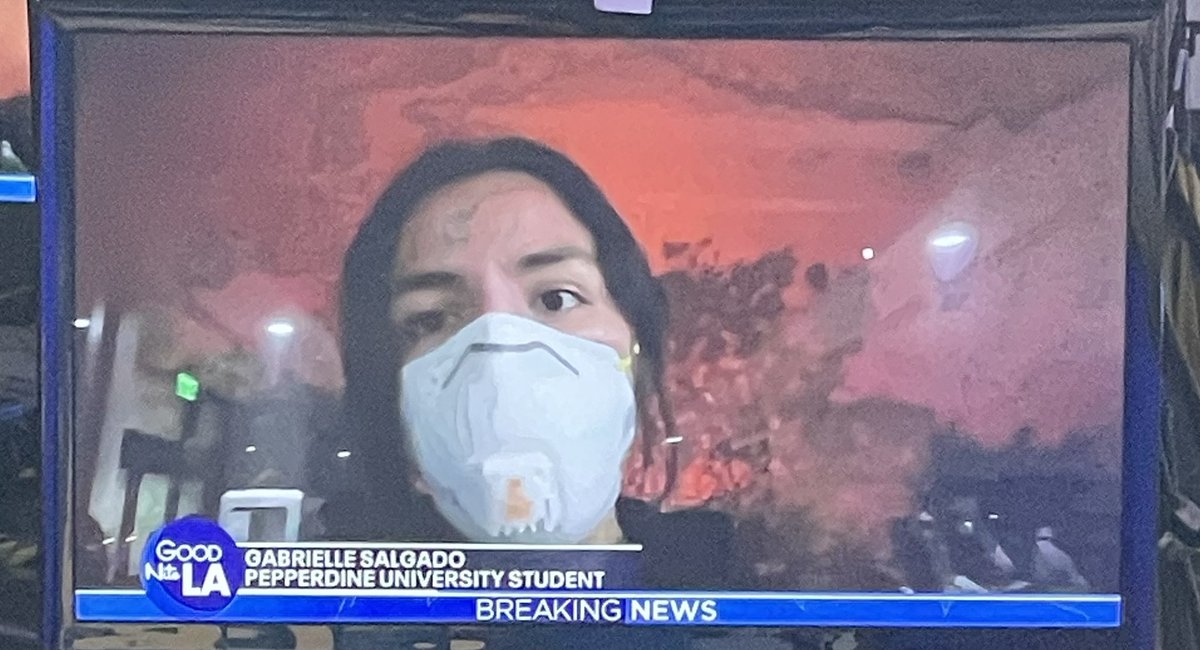 MarlaTellez's tweet photo. .@pepperdine student Gabrielle Salgado shows us how close the #Franklinfire is to campus…. the glow of the fire visible from the evacuation center on campus. 

Students are masked because of the heavy smoke, sheltering in place inside the University’s “fire resistant” buildings, including Payson Library.