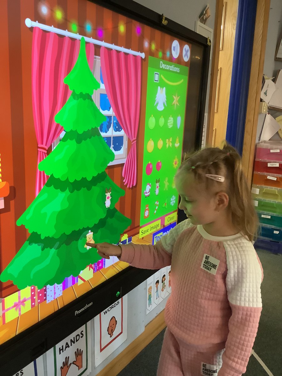 We are using our computer skills and fine motor skills to decorate the Christmas tree. <a href="/elcc_nac/">NAC Early Learning and Childcare</a> #STEM