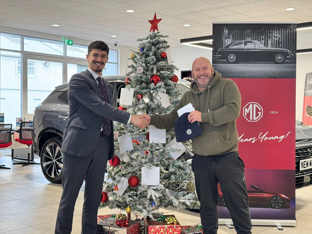 Mr Wilson is spreading the Christmas cheer at the MG Shrewsbury showroom! 🎅 While picking up his Mitsubishi L200, he picked out a prize from underneath our tree!

Thank you for choosing us Mr Wilson! We wish you a very Merry Christmas! 🎅

#BudgenShrewsbury