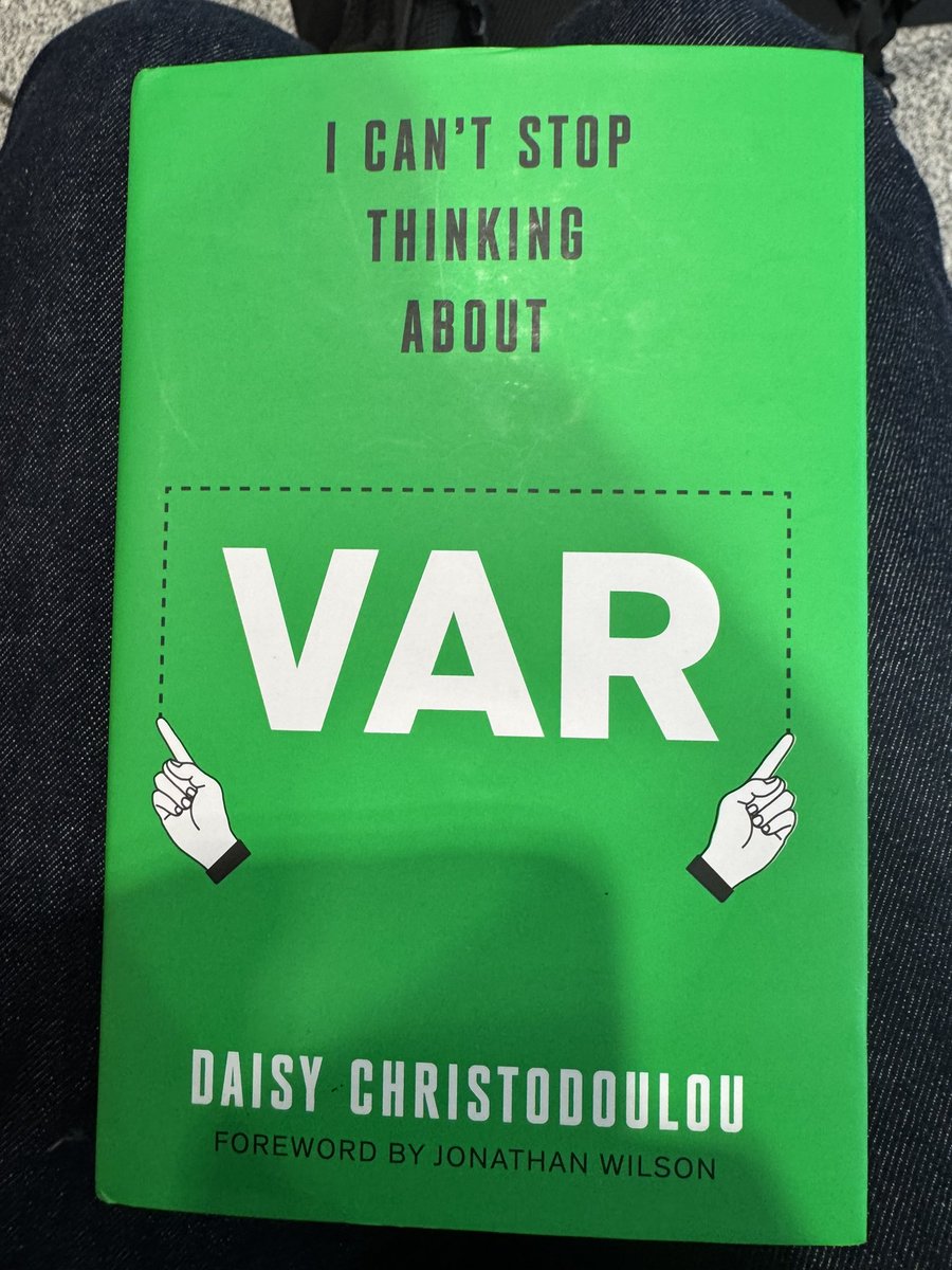 holland_tom's tweet photo. En route to Leipzig, I prepare for tonight’s big match by curling up with @daisychristo’s new book - universally hailed as THE definitive contribution to sport’s BIGGEST CONTROVERSY!!!

(Comes complete with an introduction by podcasting’s @jonawils!) https://t.co/HDyA8gjmgL
