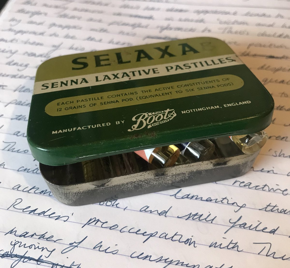 keeping perfume samples in a vintage laxative tin