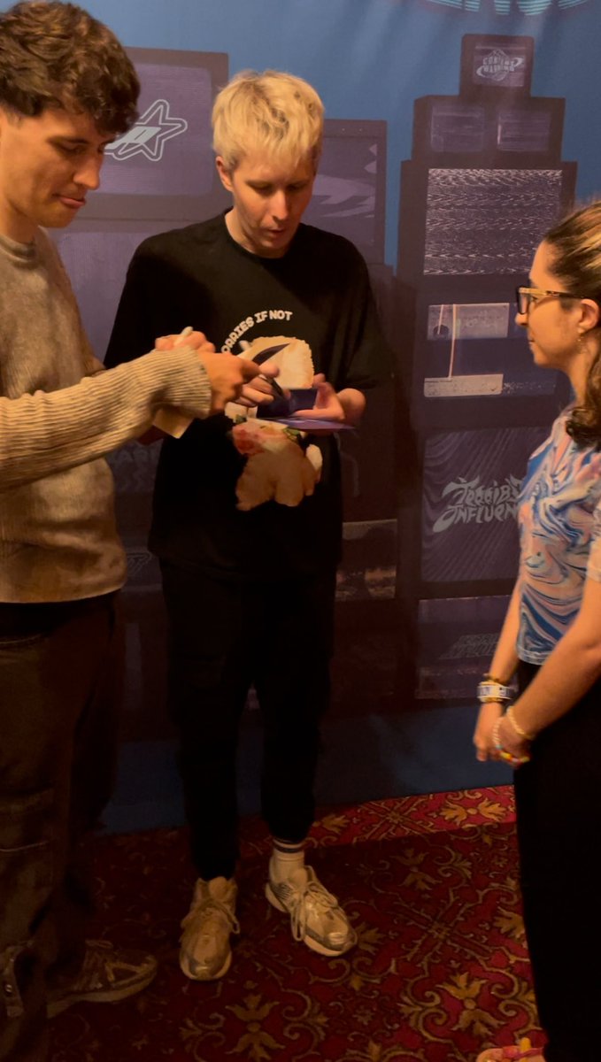 comfnchaos's tweet photo. core memory from tonight: dan signing my copy of ywgttn on a random page instead of the first bc i also had some photocards for them to sign that were placed in said random page and he probs assumed i was bookmarking it for a reason. i wasn’t. this is so hilarious to me https://t.co/LAlgSIEgpu