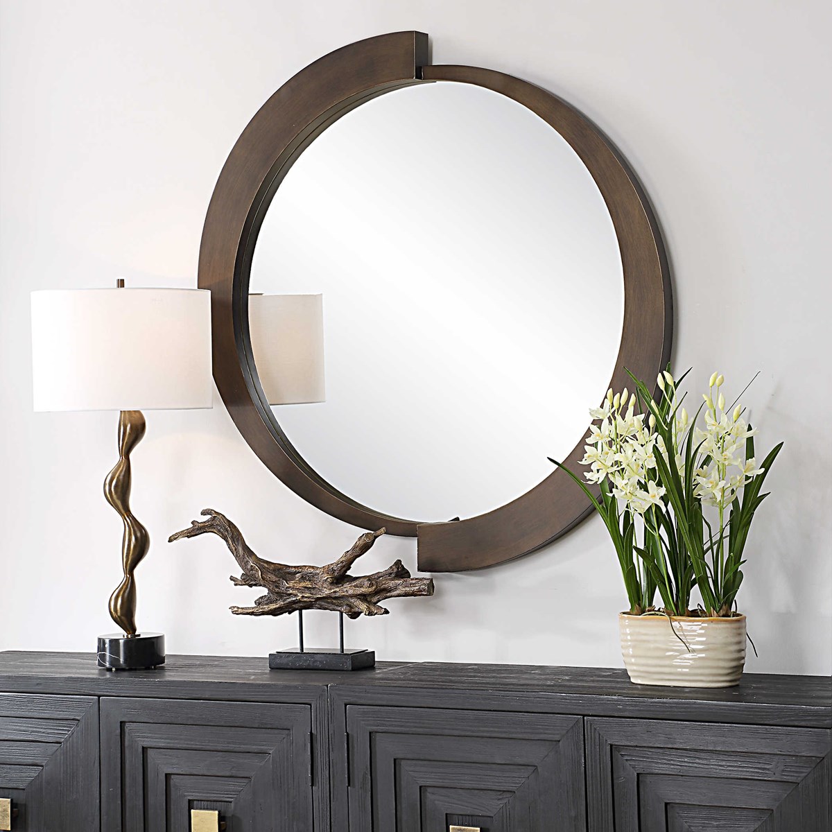 Bring some dimension &amp; modern style to your design! The Reverse Round Mirror features a three-dimensional iron frame finished in a brushed bronze with champagne undertones. Shop the full details here - l8r.it/inOk