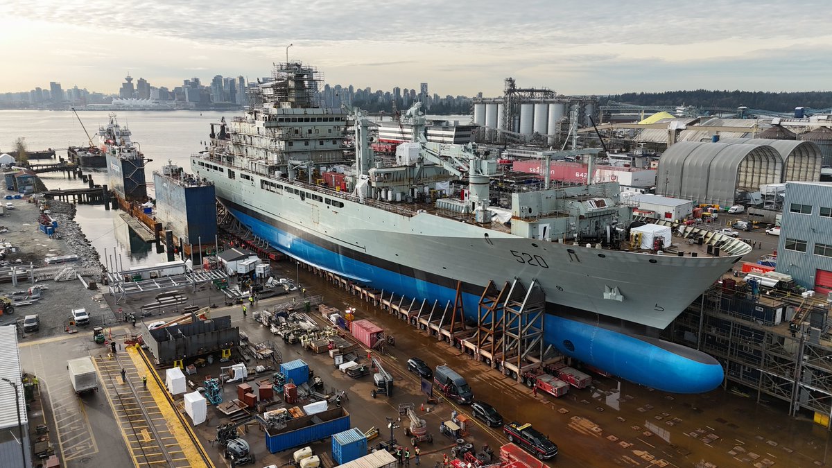 Seaspan's tweet photo. The Joint Support Ship is on the move!   

The team at Seaspan's Vancouver Shipyards is preparing for this week's launch celebration and naming ceremony for HMCS Protecteur #NationalShipbuildingStrategy #FutureFleet

@mammoetglobal https://t.co/ktnPiTJK3c
