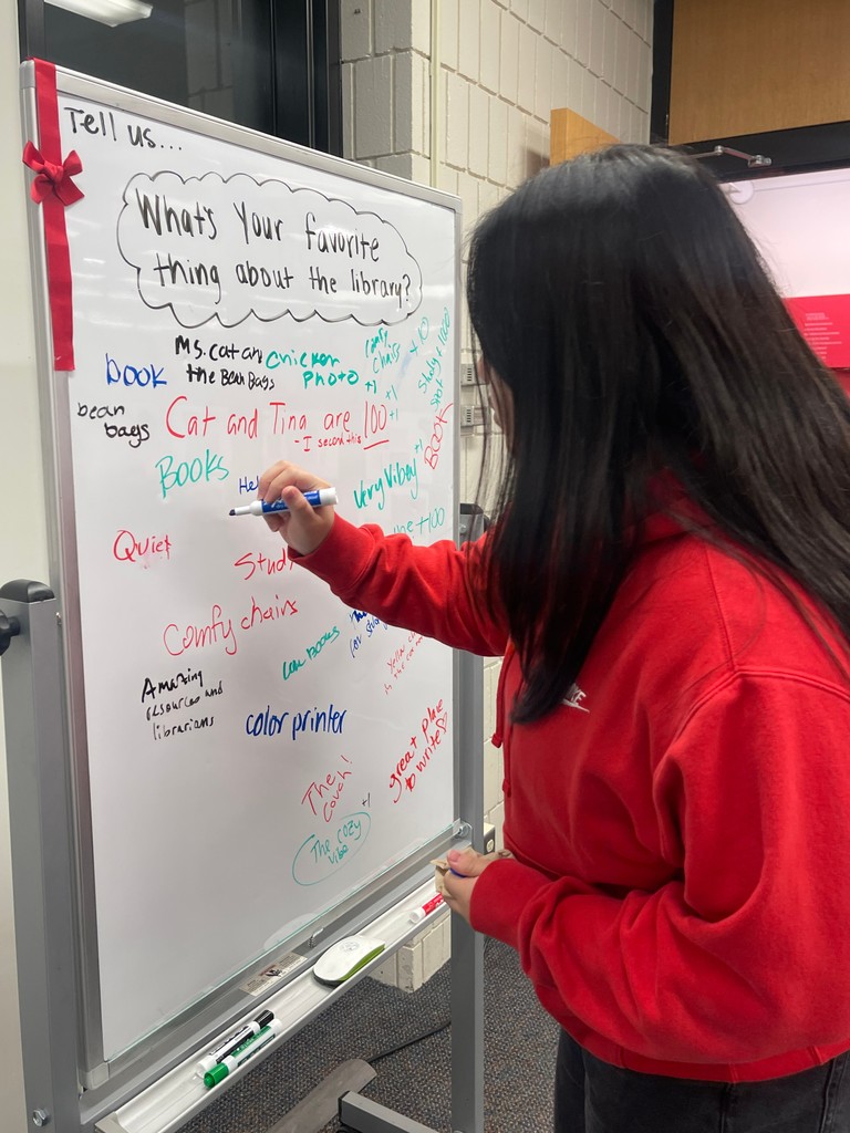 ANOTHER YEAR WISER. Students and faculty gathered in the lower library to celebrate 95 years of its glory. The party featured archives and chocolate chip cookies. 📸: Mariam Malik.