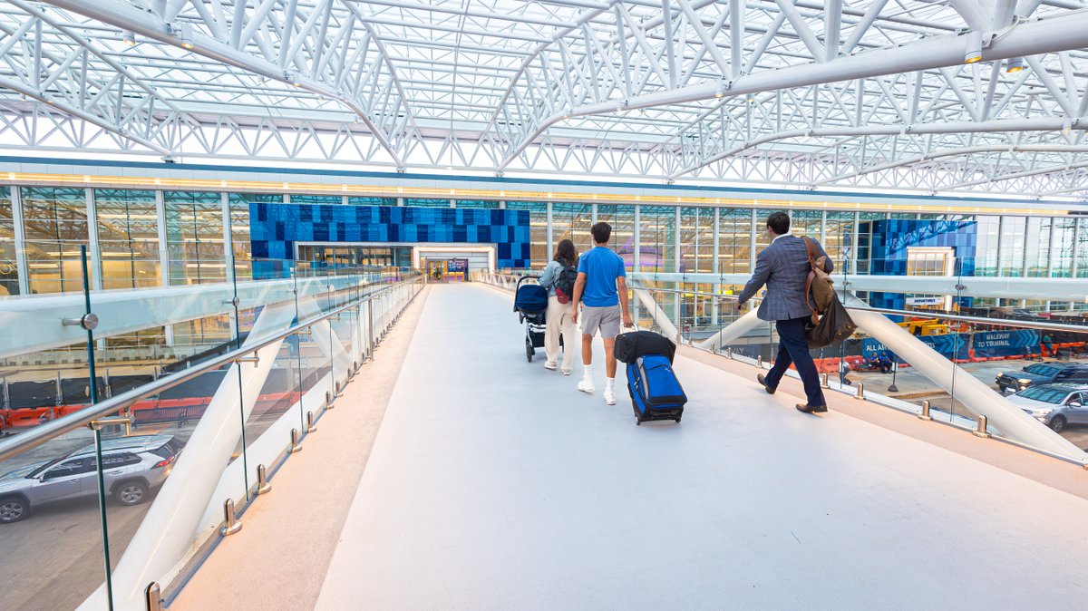 CLTAirport's tweet photo. On this day in Dec. 2019, #CLTairport broke ground on the #DestinationCLT Terminal Lobby Expansion (TLE). In the last year, CLT has added several new baggage carousels, started construction on what will be Checkpoint 2, opened the overhead walkways connecting the Hourly Deck to the lobby, unveiled two new terrazzo installations, completed the glass canopy and opened all upper-level roadway lanes.