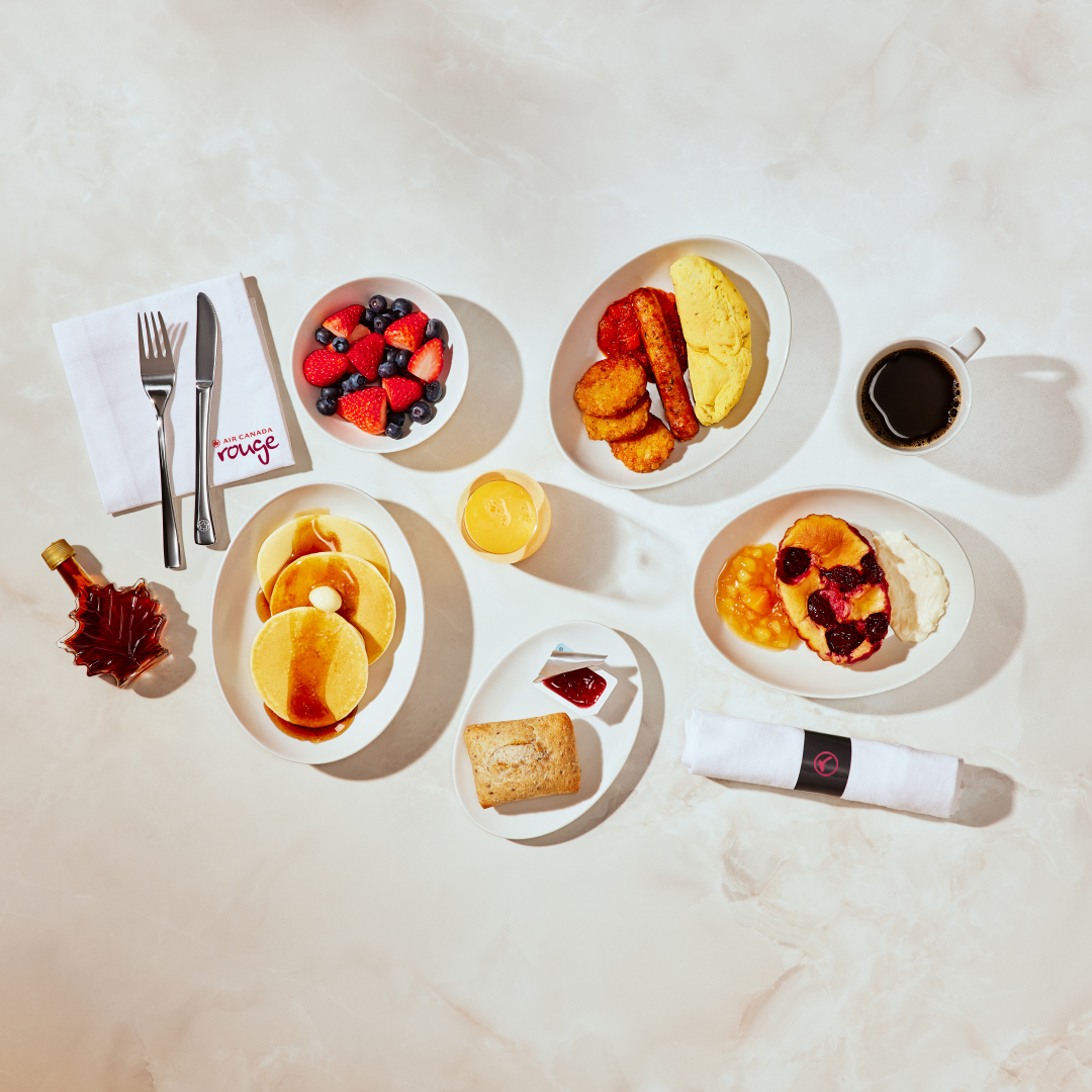 Start your day right with a warm breakfast in Premium Rouge, including new menu options like our delicious parsley omelette with chicken sausage, or traditional pancakes with Canadian maple syrup, now available on select morning flights.