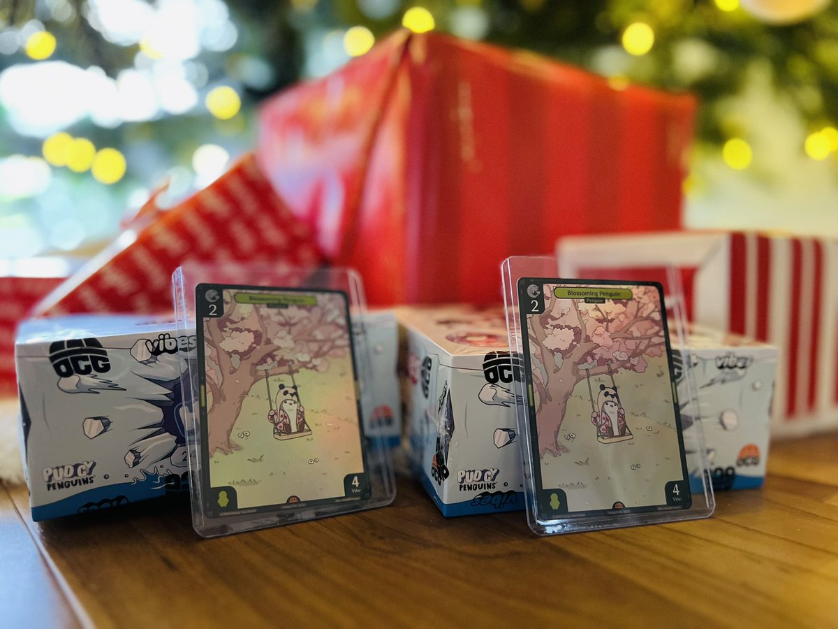 Just received two boxes of @ocapgames booster packs that I redeemed from my friends at <a href="/beezie_io/">Beezie</a>. 

Exceptional service and fast shipping and received two free Blossoming Penguin cards. 

Should I crack these packs or leave them under the tree for awhile longer?