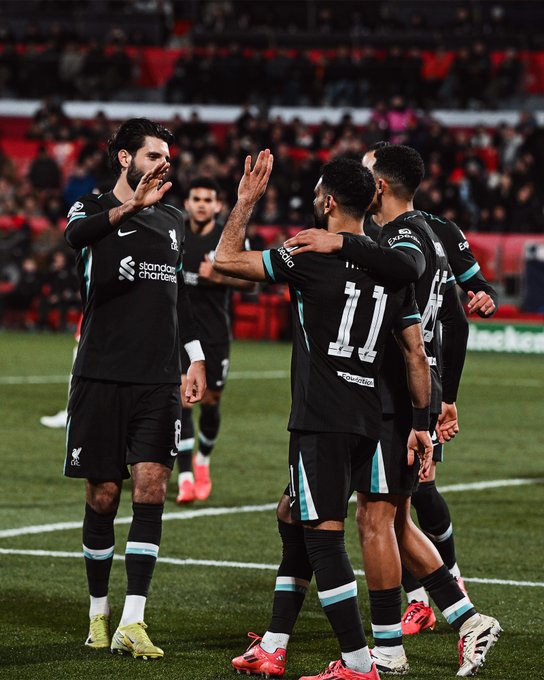 Photography of Dominik Szoboszlai and Mo Salah celebrating Salah's goal against Girona.