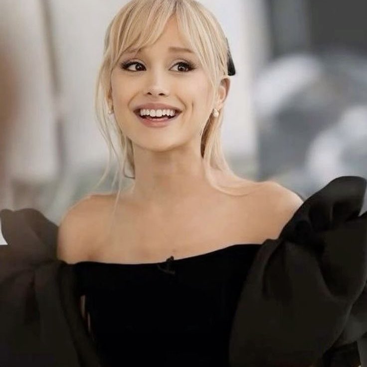 She can't understand why everyone is laughing, so she doesn't look foolish she laughs too