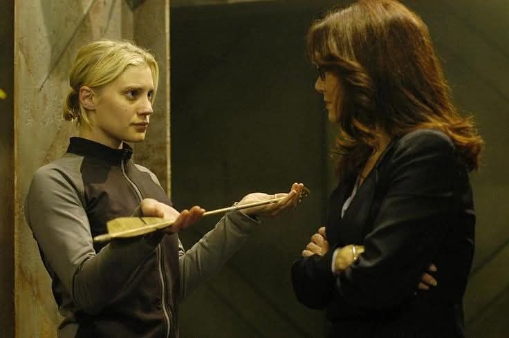 President Laura Roslin is excited that Kara Thrace brought back the Arrow of Apollo from Caprica. Katee Sackhoff, Mary McDonnell. "Battlestar Galactica".