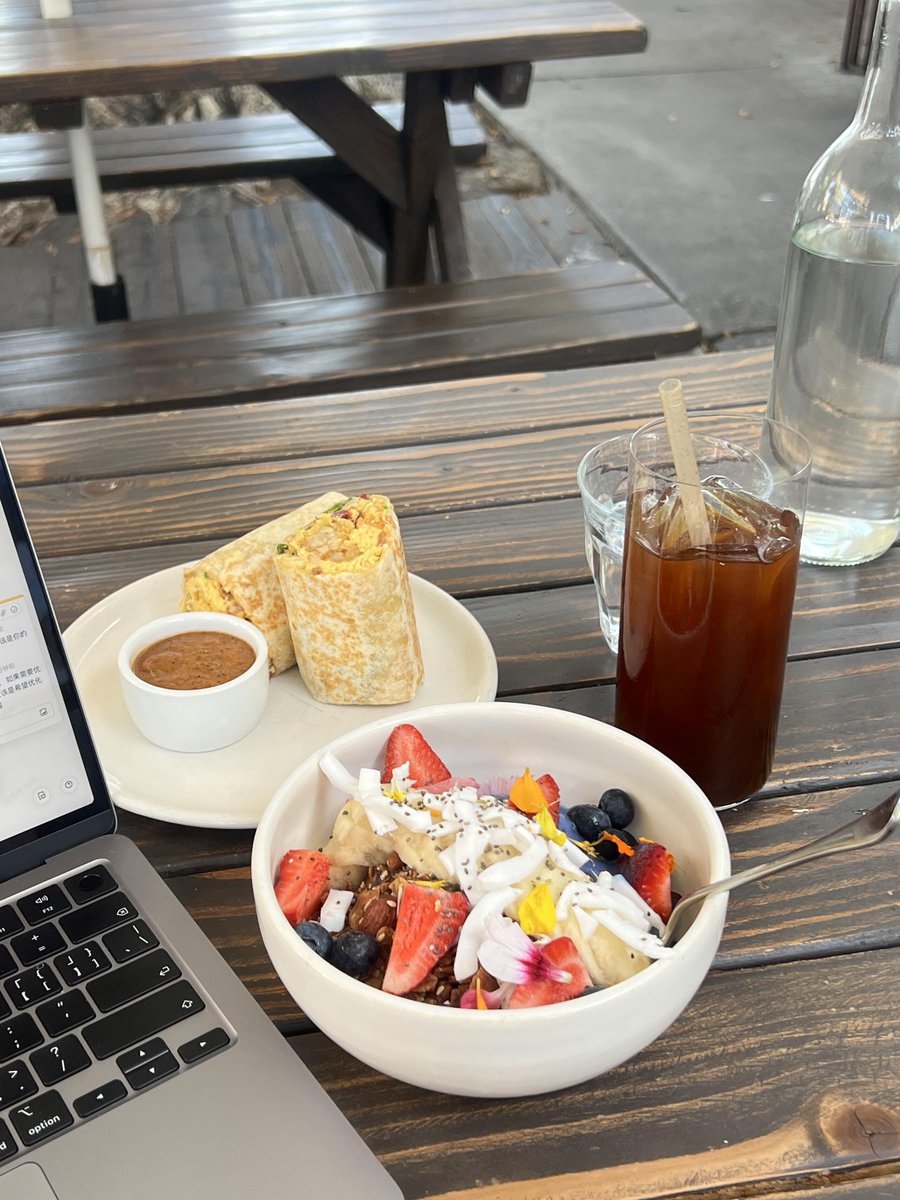 Eating a delicious breakfast wrap and a fruit oatmeal bowl with an iced coffee, life is so good!