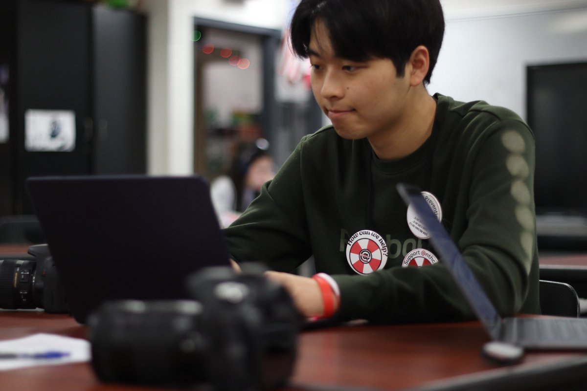 Staffer reviewing images from events (Slamming for a Cause) and all things New Tech.   #NTHCLegacy