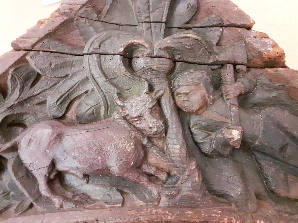 ConservationBob's tweet image. Ipswich Museum Conservation for redevelopment. Michael has been cleaning a medieval spandrel depicting 2 butchers pole axing a bull.  Vacuumed, brushed, wet cleaned and waxed to bring out the colour. The original paint can de seen after cleaning.