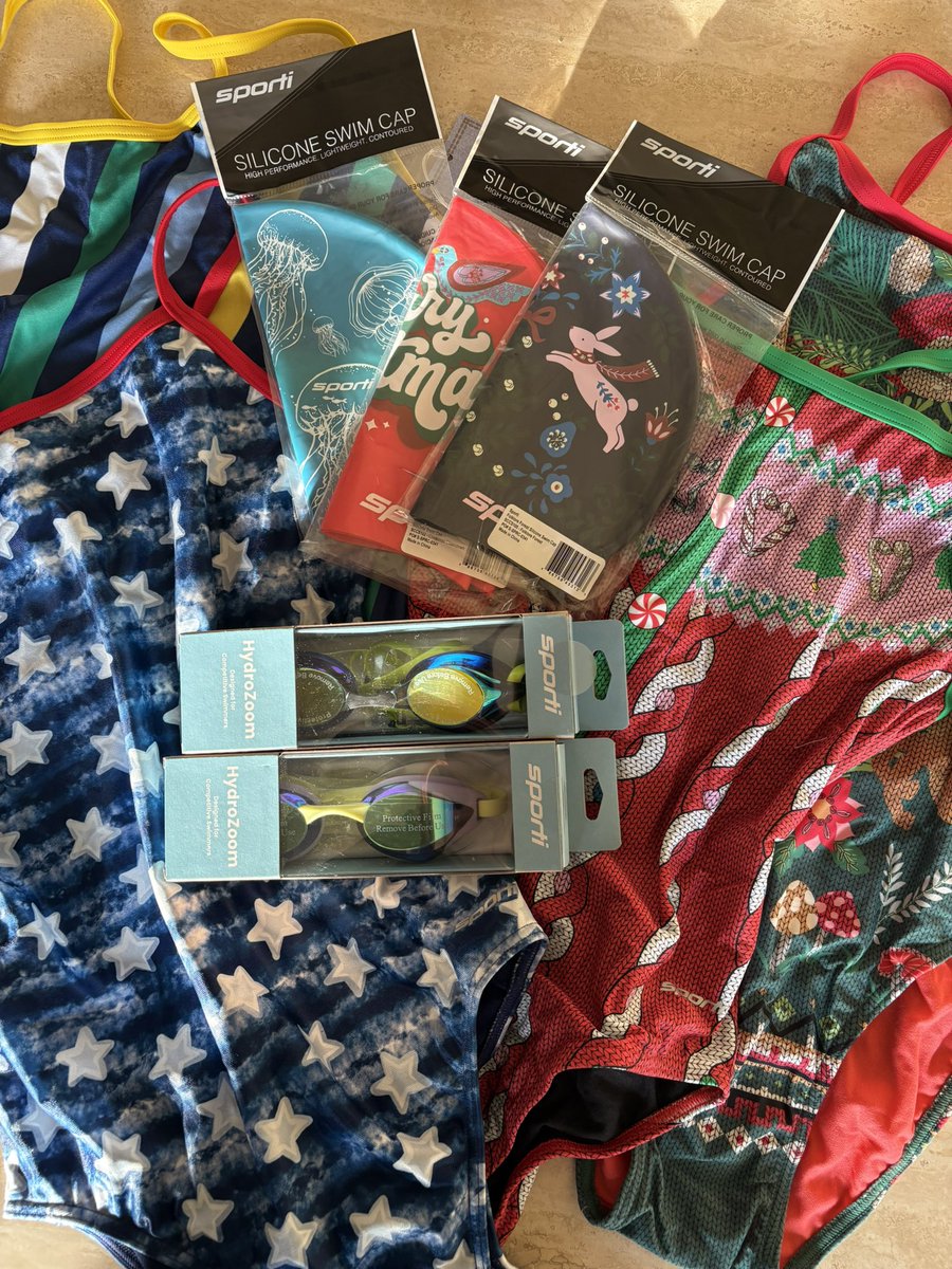 jeanhofmann's tweet photo. My @USASwimming #12DaysofGiveaways package from @SWIMOUTLET arrived yesterday. I am overwhelmed by all the cool Sporti gear! 4 swimsuits! 3 caps! 2 pairs of goggles! Are you kidding me? Thanks EVERYONE! https://t.co/7VMHzW5b4Z