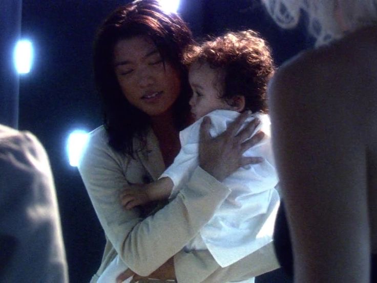 Sharon "Athena" Valerii saves daughter Hera from a Cylon basestar. Grace Park, "Battlestar Galactica".