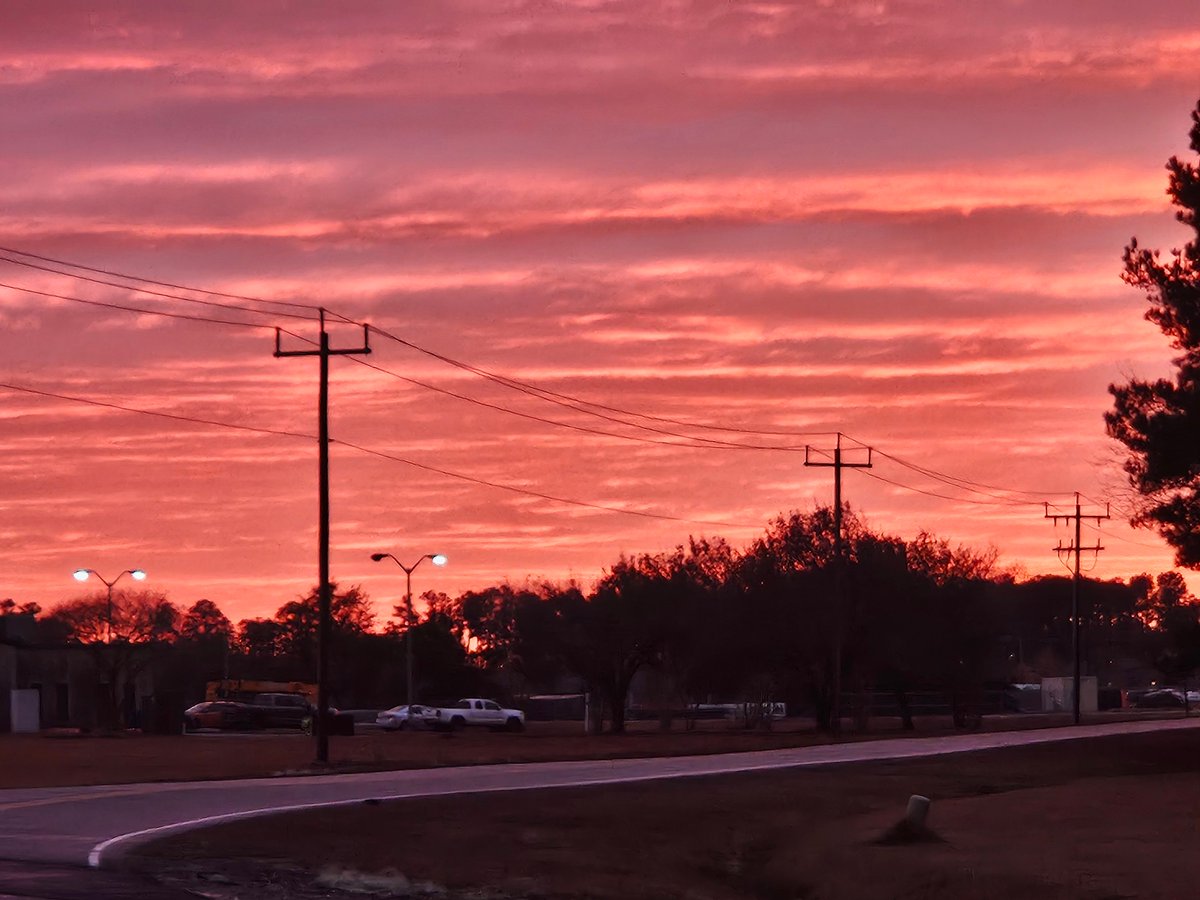 NWSWilmingtonNC's tweet photo. After the rain and wind, this day actually ended up on a high note here at the NWS office at the ILM Airport! A  gorgeous sunset to the southwest while simultaneously, a partial rainbow off to the northeast!! "Red sky at night, sailors delight" #ilmnc #ncwx #scwx https://t.co/6WozhxVn3w