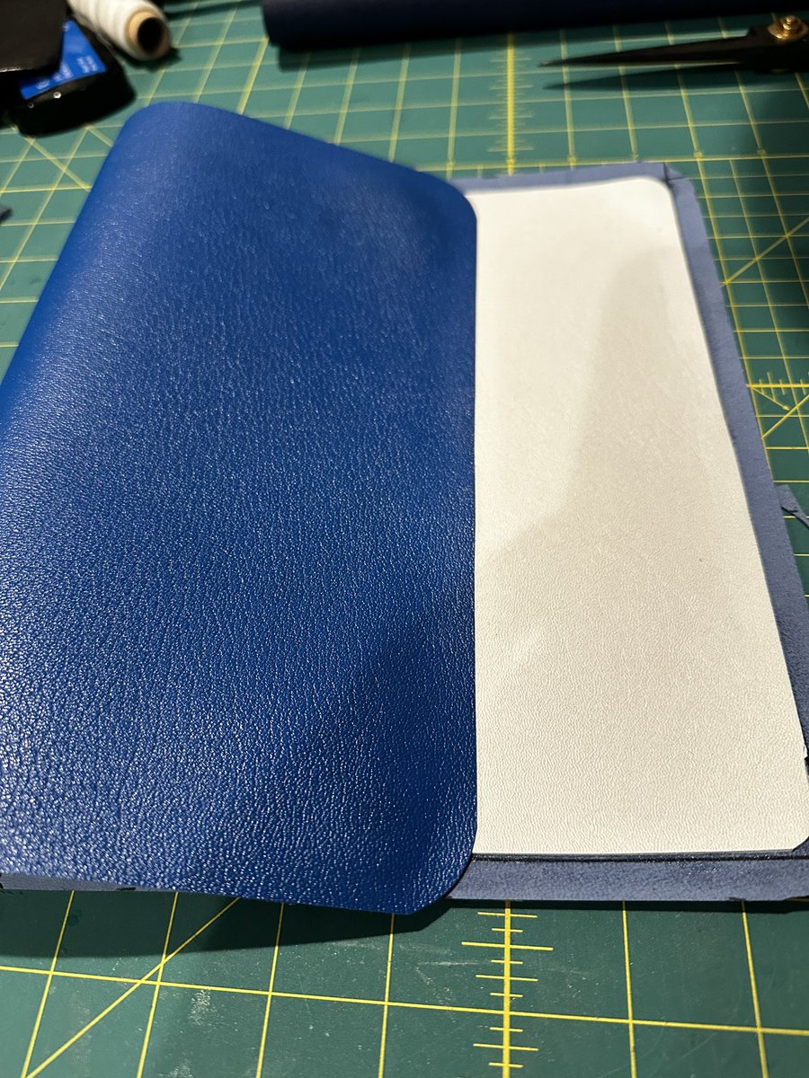 What’s on the table tonight? Re-gluing together the Bible that I hand stitched signatures back together onto it, 2 covers for Bibles that hopefully will be done for Christmas!