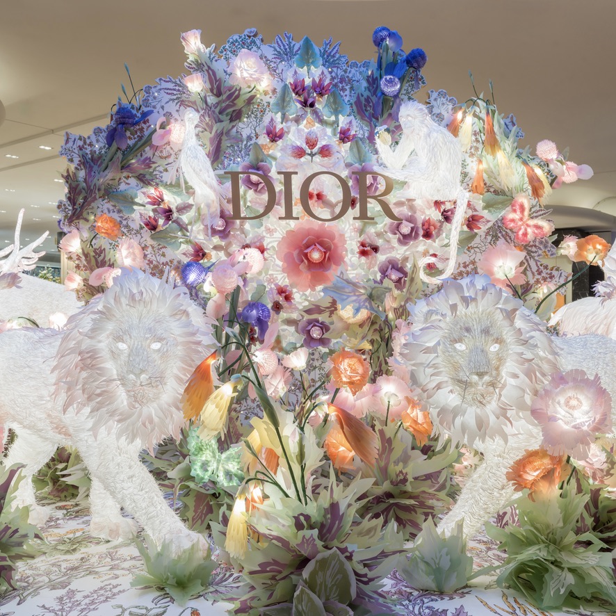 Dior's tweet photo. A floral fantasy is calling at Galeries Lafayette's Dior pop-up, where LiDAR technology makes flowers bloom right beneath your feet. See the magic for yourself—tap the card to activate the filter.