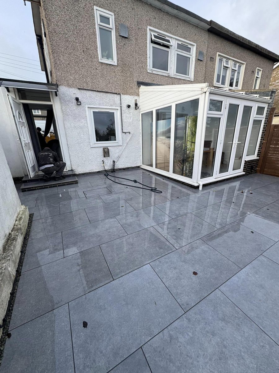 Another beautiful transformation by Building &amp; Landscape Design by Keith Poynton! 🌟

From a mix of old paving, stone chippings, and worn-out decking to this sleek and modern porcelain patio. They’ve used Castacrete Limited ‘Serena’ in anthracite for that sharp, clean look.