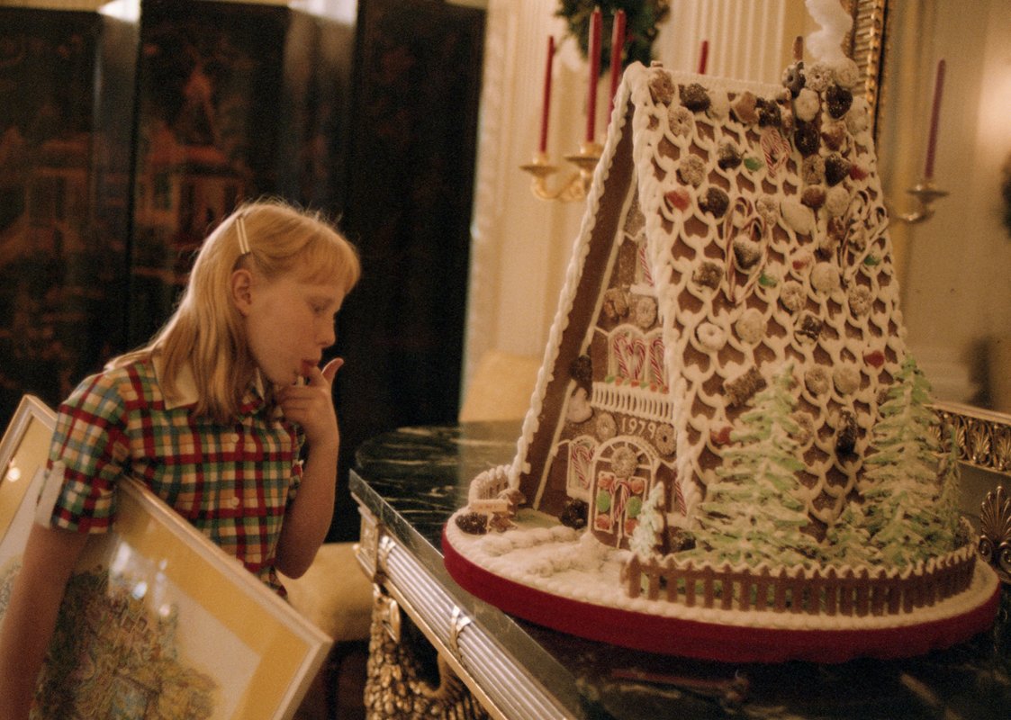 CarterLibrary's tweet photo. Timeline cleanse with a sweet pic of how everyone really wants to react to a gingerbread house! Image: NLC14668.20 #CarterLibrary #PresidentialLibrary #FamilyFirst #EnjoyTheMagic https://t.co/inPeiLySDV