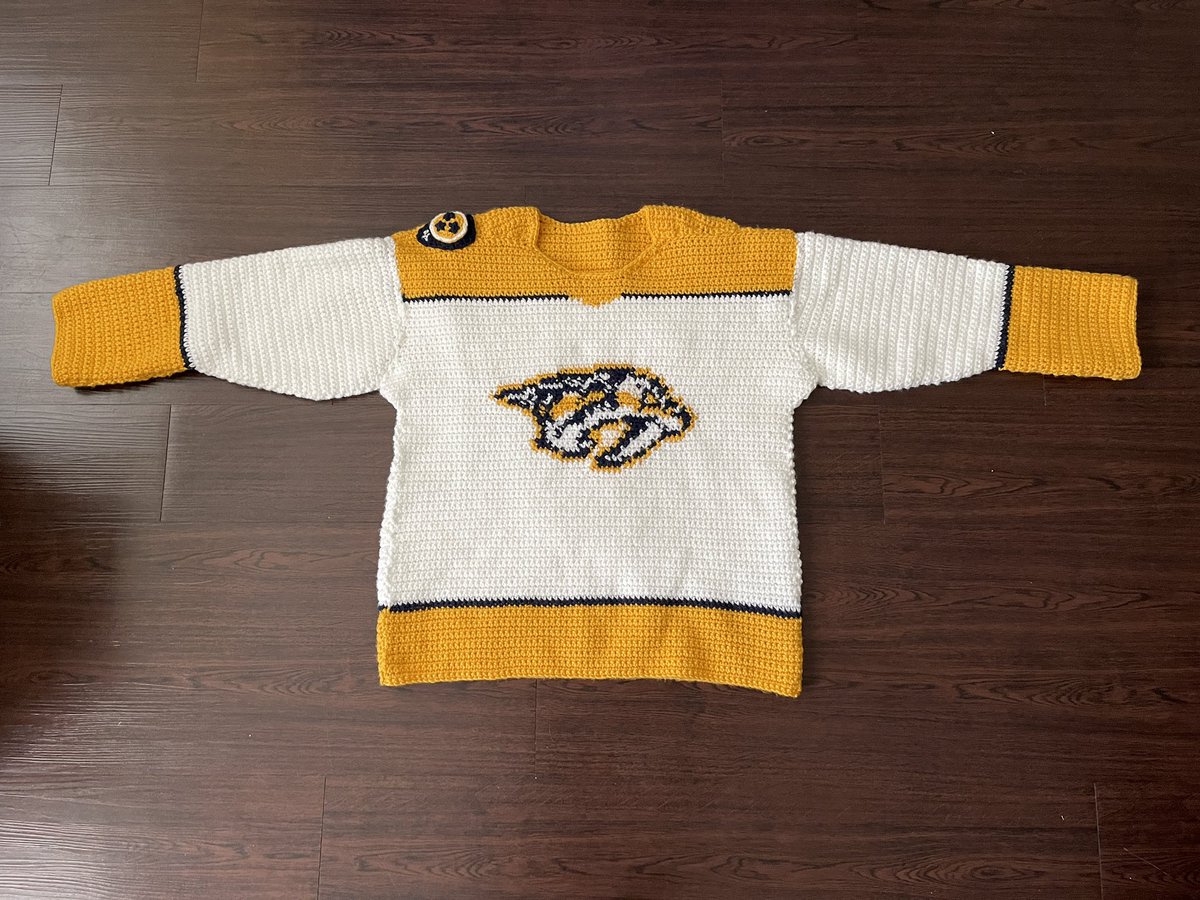 The_Pred_Head's tweet photo. Also - I’m bringing the crochet jersey to wear to one of the games! 🥳  #smashville 

Should I bring the #predhead? 👀 https://t.co/3Ps4kiTMus