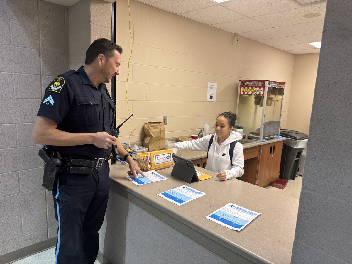We are so thankful for Officer Alexander 👮🏻‍♂️ We love seeing him the the hallways, cafeteria, and classrooms. Today he was purchasing some “sit by a friend at lunch” coupons with his Bobcat Bucks 🐾💰#TogetherWeThrive #OPSProud