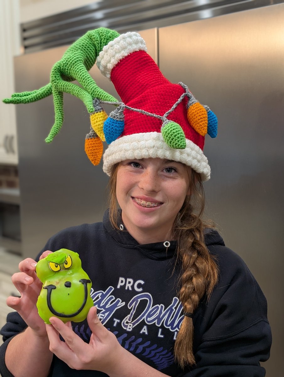 AddisonD2028's tweet photo. My LONG-time hitting coach, Coach Toot, gave me some Grinch donuts after our lesson last night! And then my Mom won this Grinch hat at Secret Santa today at work! I promise I'm not a Grinch!!! Or am I? ;) #stink #stank #stunk https://t.co/I6ryTyMfqp