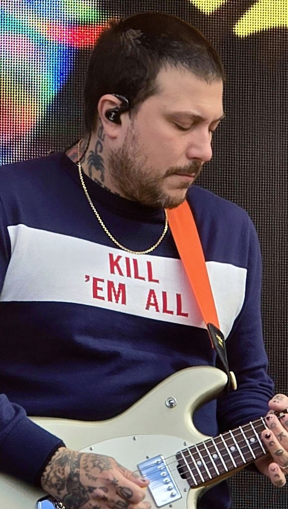 FrankOnThisDay's tweet photo. On this day in 2002:

My Chemical Romance played in Richmond, VA. But more importantly, today was the day that Frank got his iconic scorpion neck tattoo. Here is Frank telling that story, a photo of him from the day after, and how it looks now in present-day (taken by me) https://t.co/BWnjAC6WLa