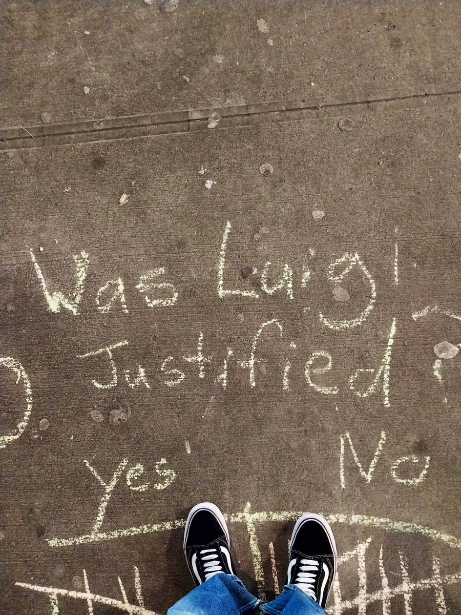“Was Luigi justified?
Yes No”
written in chalk on the street