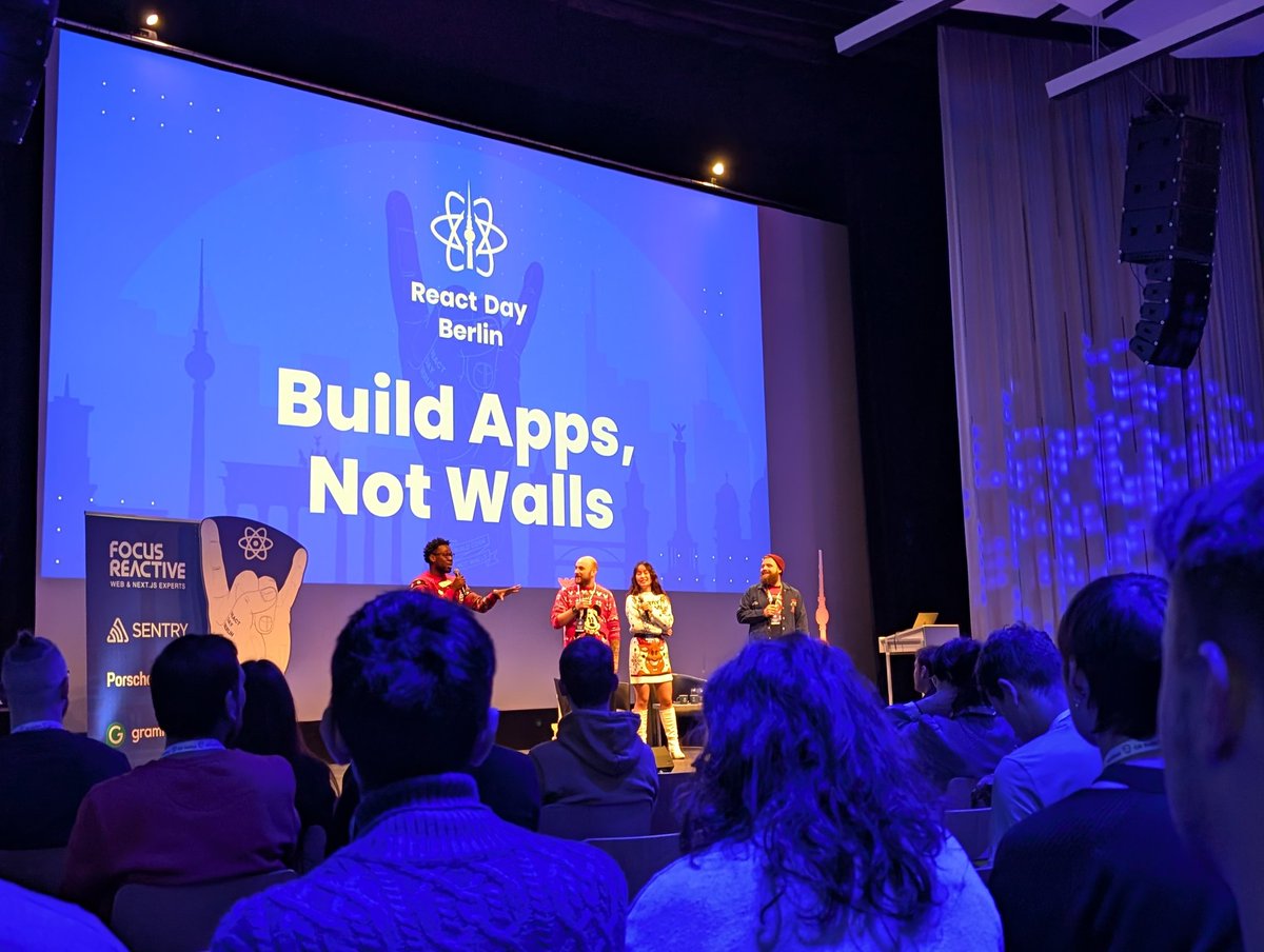 Here we go <a href="/reactdayberlin/">React Day Berlin 🗓 December 13 & 16</a>! #ReactDayBerlin Loving the Christmas jumpers MCs! 🎄🎅