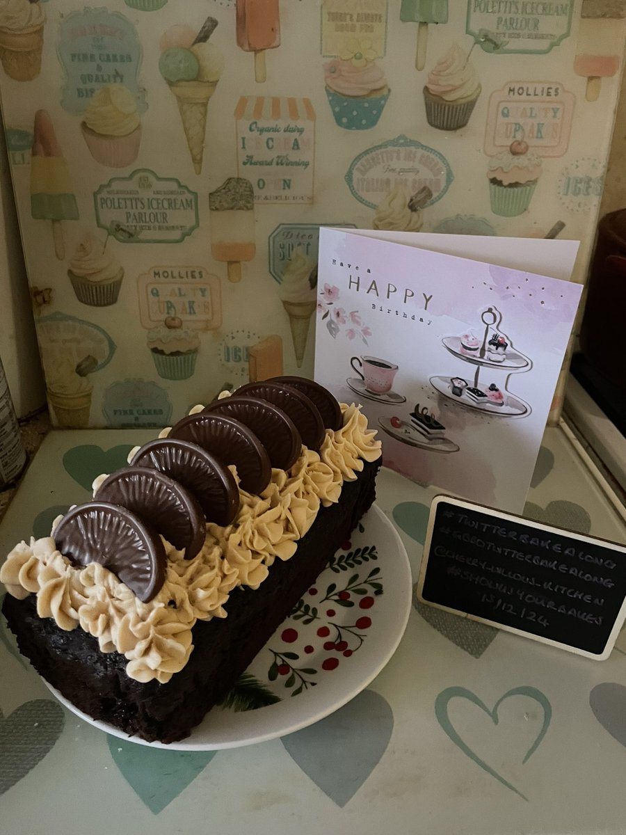 cherry_willow_'s tweet photo. It’s my birthday today so for the #twitterbakealong with @cotswoldflour I’ve made @janespatisserie chocolate orange loaf cake

It’s a moist chocolate cake with melted and chopped chocolate orange in the sponge and the buttercream. 

Decorated with chocolate orange slices! 🎂 https://t.co/alxassXQlQ