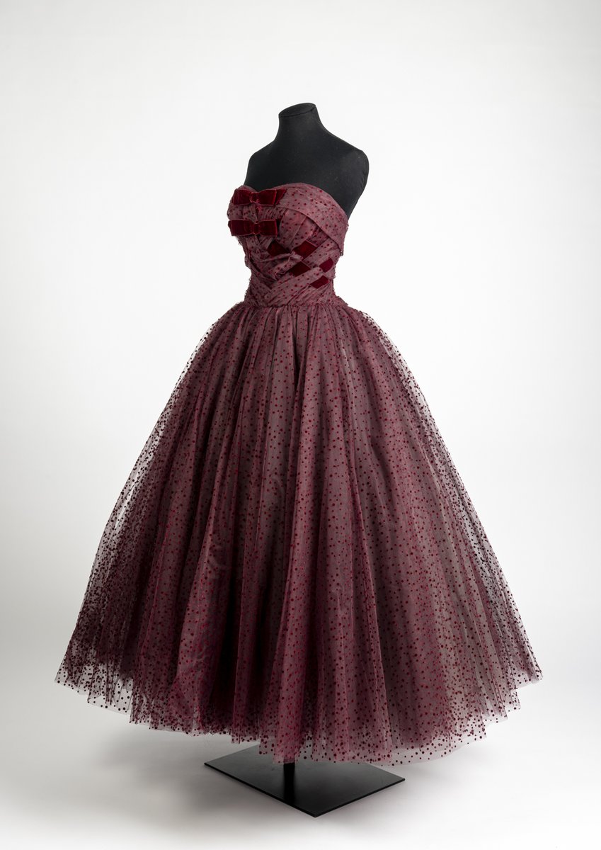 Friday Treat Time and a touch of festive elegance courtesy of top London  couturier Hardy Amies. Made from a sumptuous silk tulle with flocked velvet  spots, this 1960 burgundy evening gown captivates